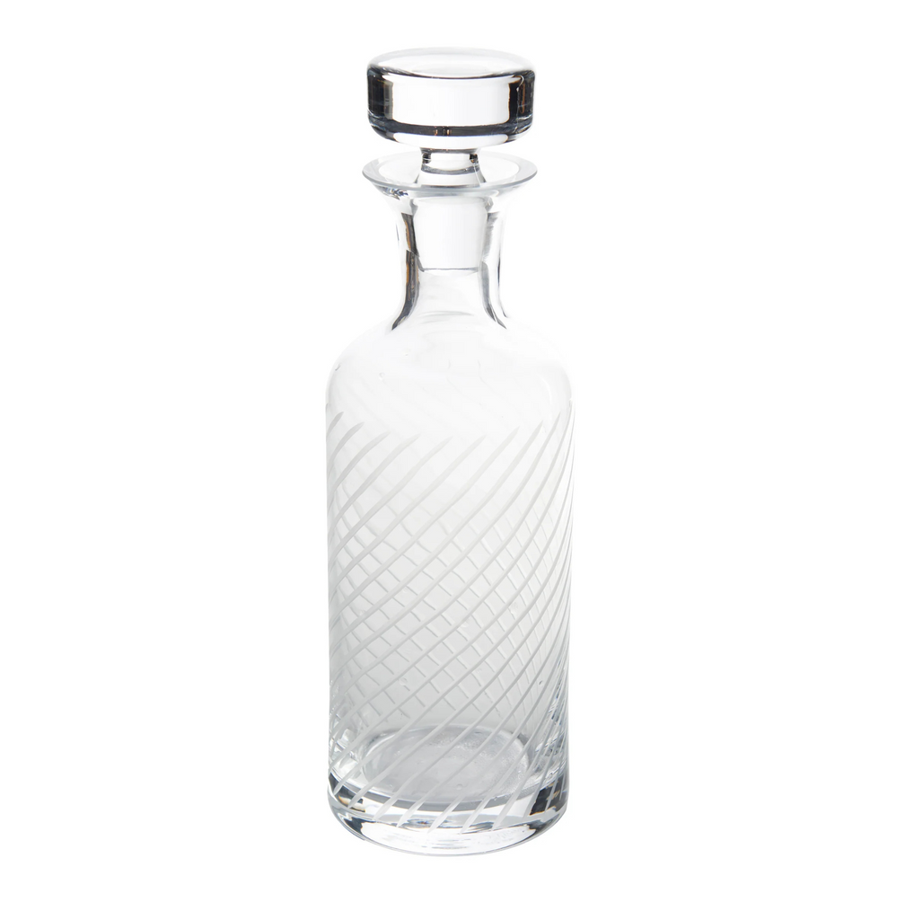 Clear glass decanter with a textured design on a white background - The Well Appointed House